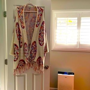 Beautiful bohemian sweater . Shapes beautifully . You will get compliments.